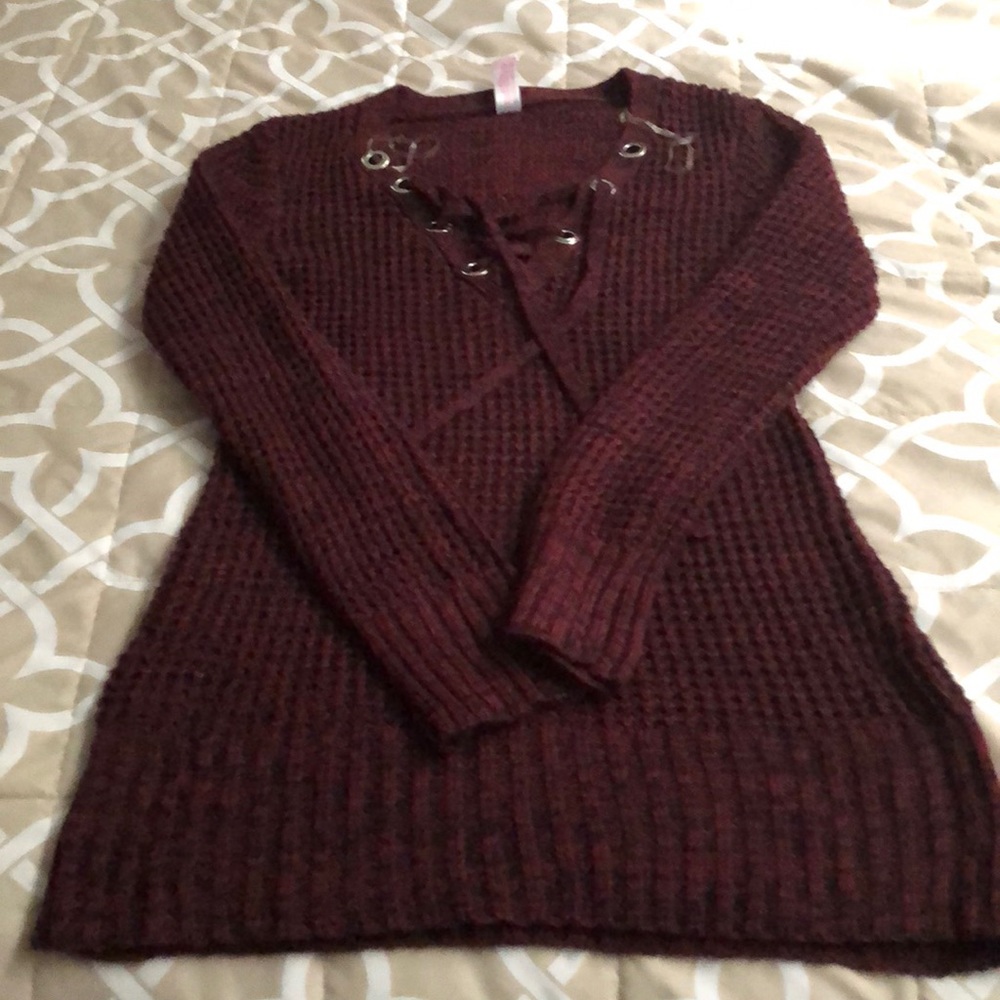 sweater is over the hip